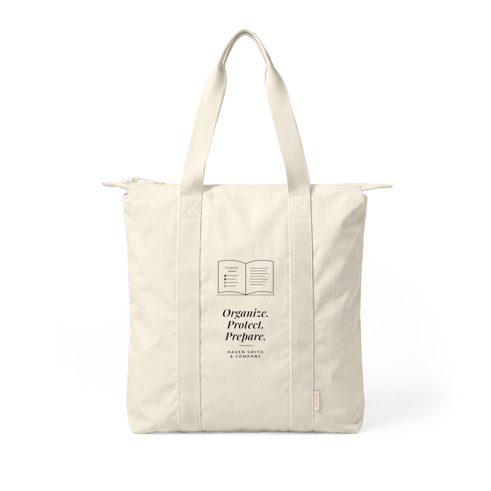 A natural canvas carry-all tote with a line drawing of an open book and the words Organize. Protect. Prepare.
