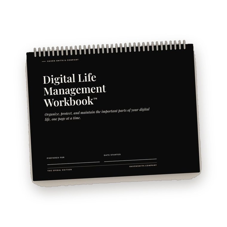 The black Digital Life Management Workbook, spiral bound along the top.
